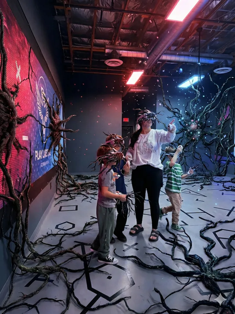 Families and friends enjoying group VR gaming experience at PlayLab PHX virtual reality arena in Phoenix Arizona